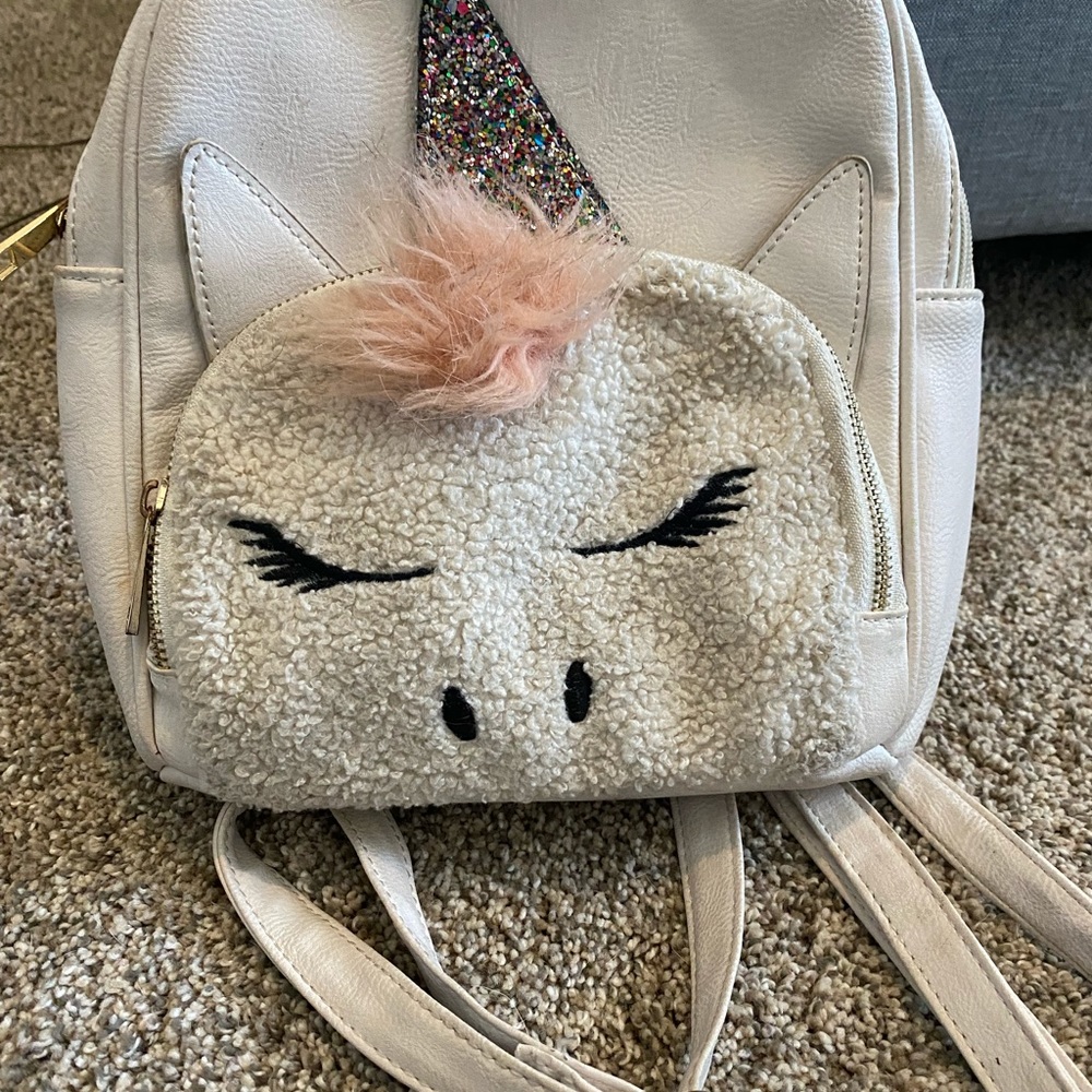 White and pink unicorn mini book bag